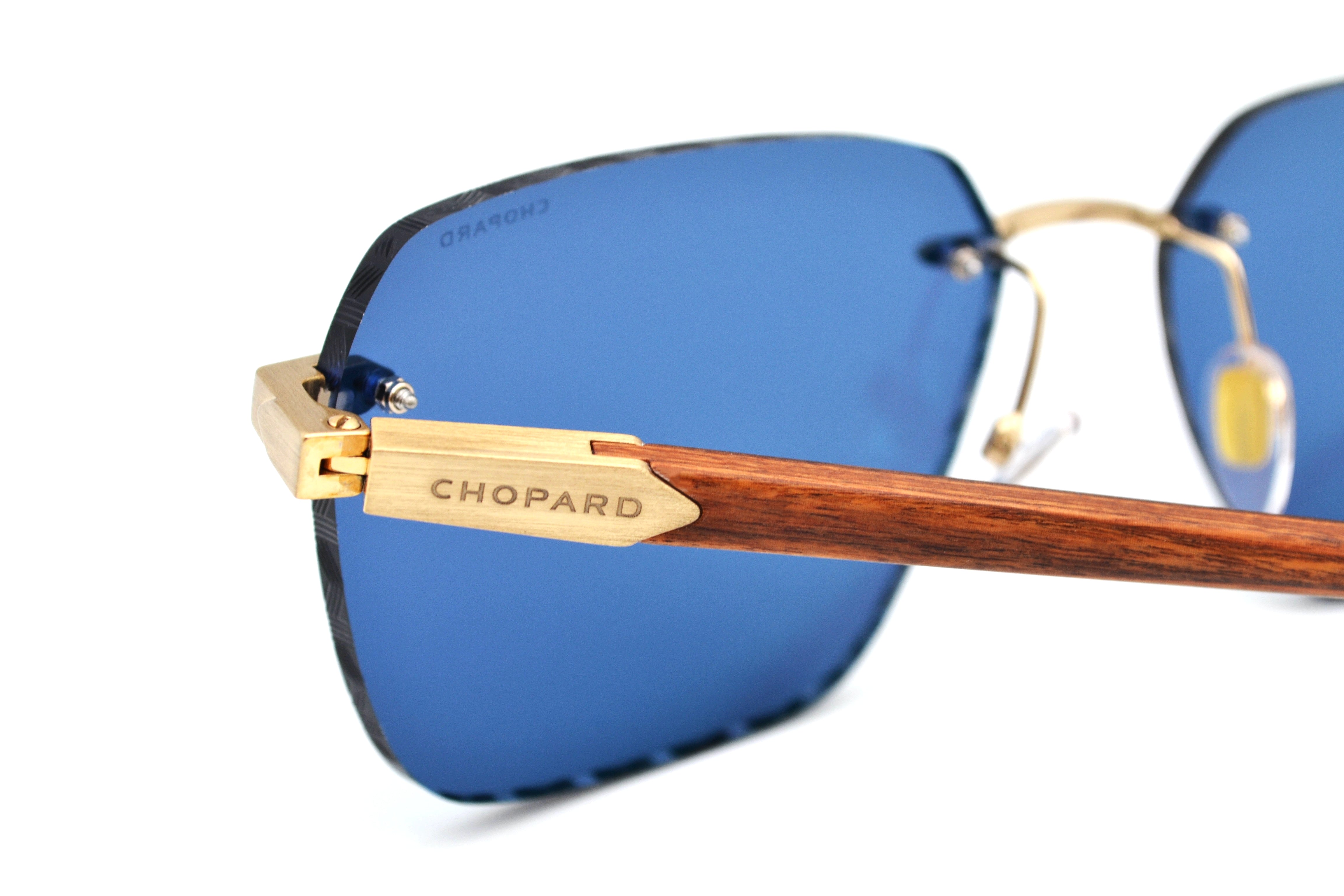 Gafas de sol Chopard SCHG62V 383P Diseño rectangular de madera y metal, lentes azules