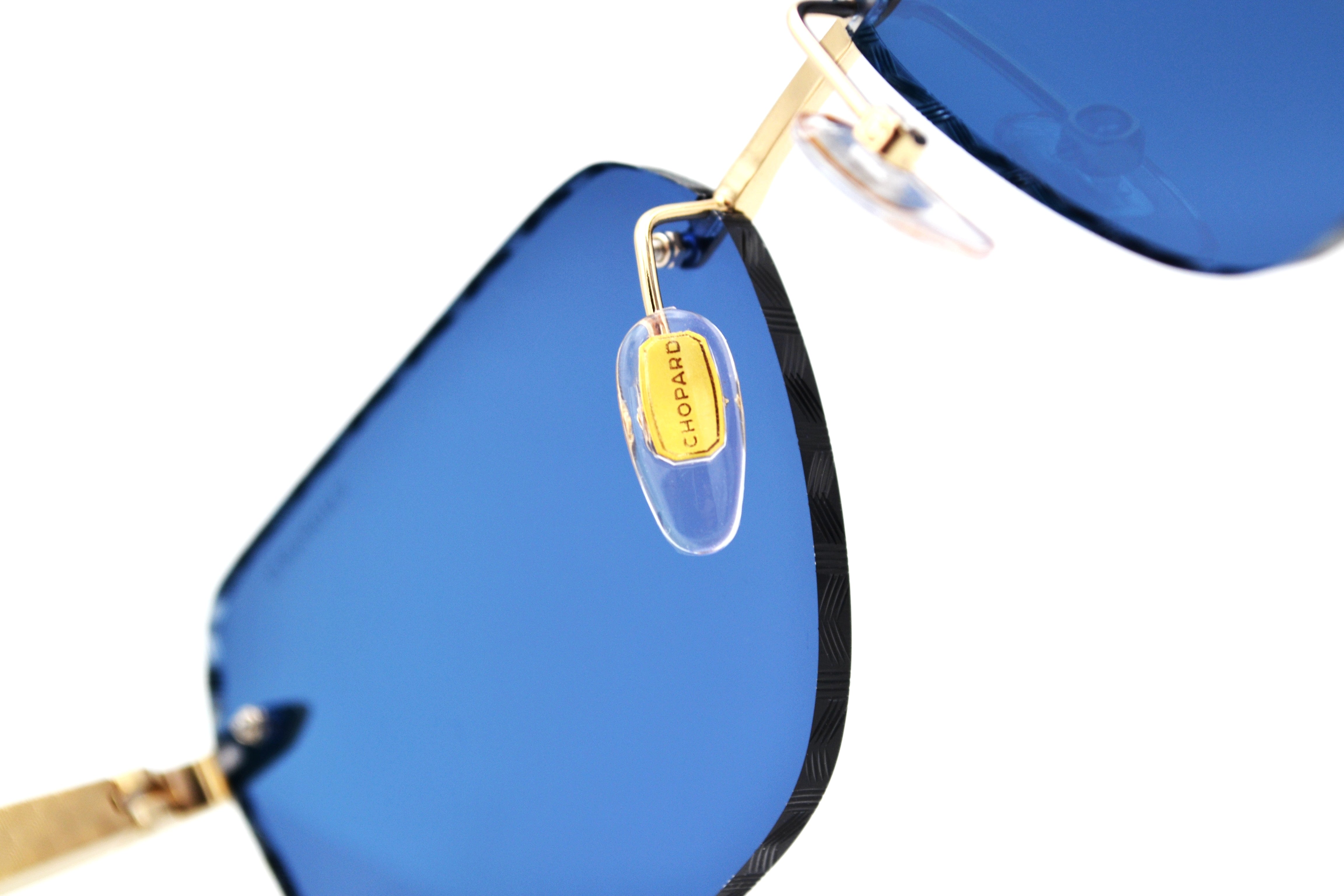 Gafas de sol Chopard SCHG62V 383P Diseño rectangular de madera y metal, lentes azules